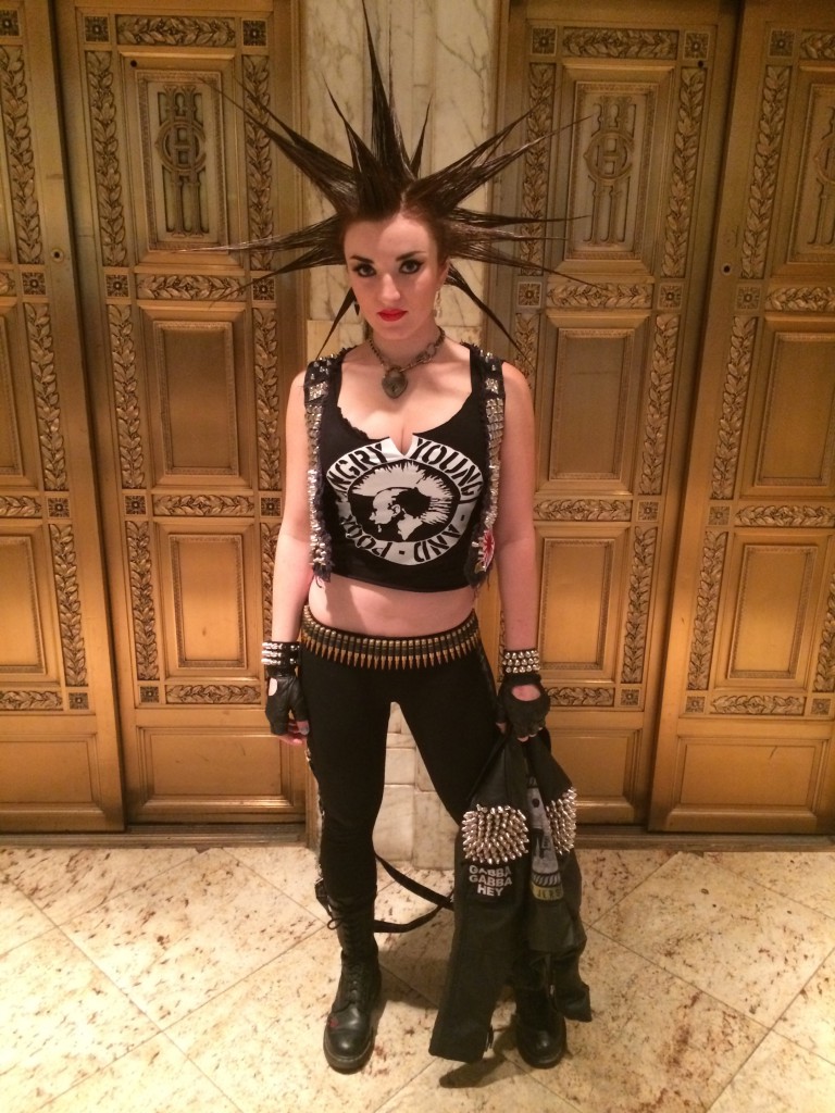 Erin is wearing studs and spikes, leather cuff, bullet belt, and AYP DIY customized tee.  She is also wearing Lip Service Bondage Leggings, and her own vest & gloves.