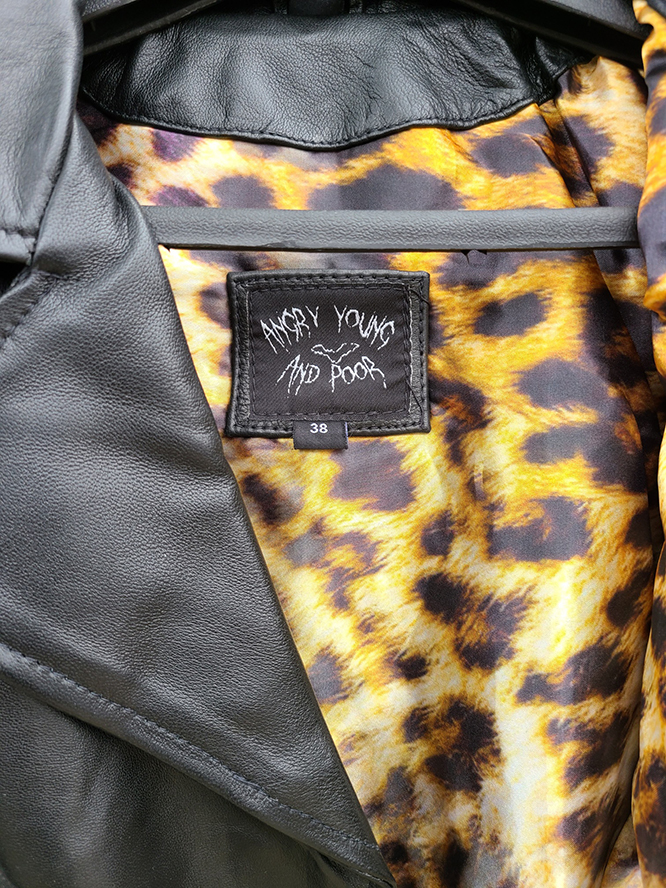 Black leather jacket with leopard print lining